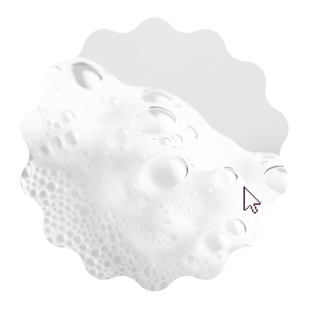 A close-up of a white, bubbly foam or gel texture with translucent bubble circles on a white background, presented inside a scalloped circular frame.